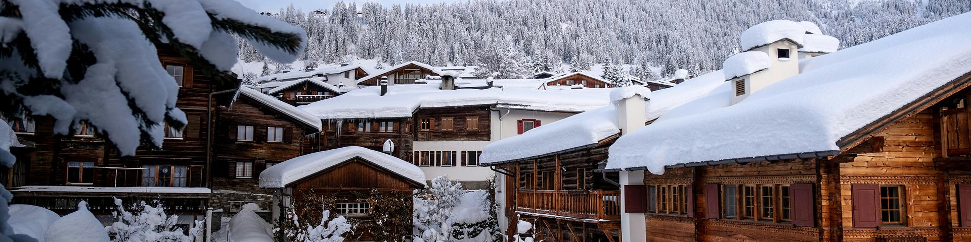 village buildings covered in snow